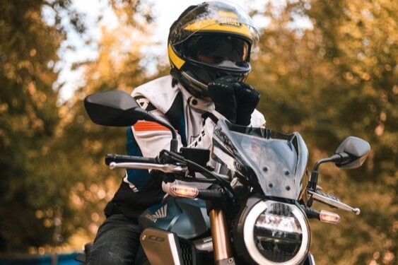 Honda CB rider in helmet and jacket