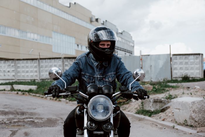 motorcycle rider riding through cones.