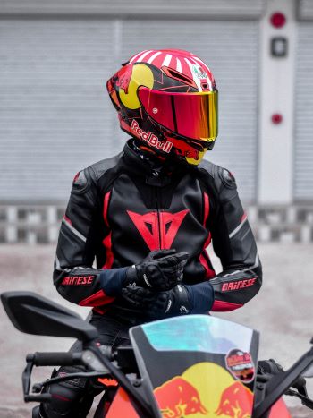 biker in full leather gear and helmet