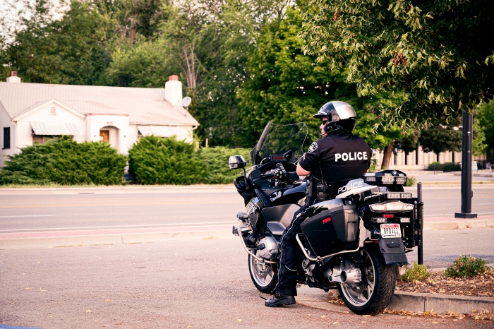 motorcycle rider riding through cones.