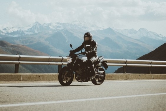 rider in all leather gear on a naked bike